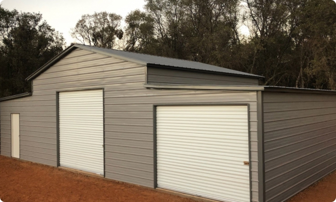 grey metal building with 3 bays