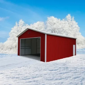 A 24X30X10 Vertical Roof Metal Garage in the snow with trees in the background.