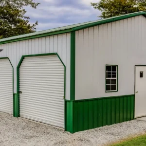 A green and white 24X35X10 Vertical roof Metal Garage with two doors.