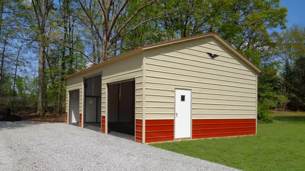 A 24X35X11 Vertical Roof Metal Garage with a red door.