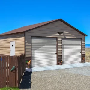 A 26X20X9 Vertical Roof Metal Garage with two vertical doors and a fence.